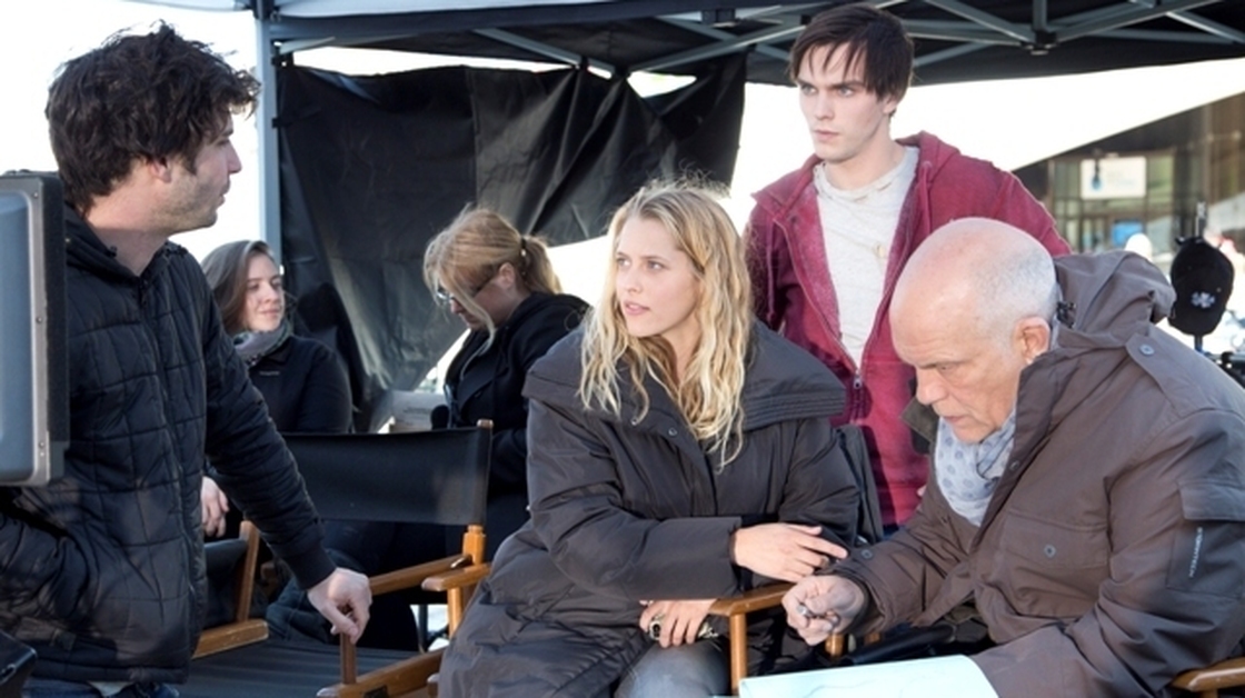 Director Jonathan Levine (far left) offers script notes to Teresa Palmer, Nicholas Hoult and John Malkovich on the set of Warm Bodies.