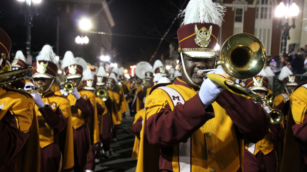 The McDonogh 35 High School band marches in a parade to usher in the Carnival Season.