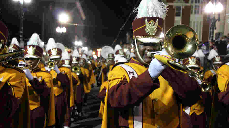 The McDonogh 35 High School band marches in a parade to usher in the Carnival Season.
