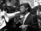 Attorney General Robert F. "Bobby" Kennedy uses a bullhorn to address a crowd of demonstrators, June 14, 1963, at the Justice Department. Four months earlier he had walked 50 miles in one day to prove to his brother John that he could do it. His march helped make extreme walking and hiking popular activities. Attorney General Robert F. "Bobby" Kennedy uses a bullhorn to address a crowd of demonstrators, June 14, 1963, at the Justice Department. Four months earlier he had walked 50 miles in one day to prove to his brother John that he could do it. His march helped make extreme walking and hiking popular activities.