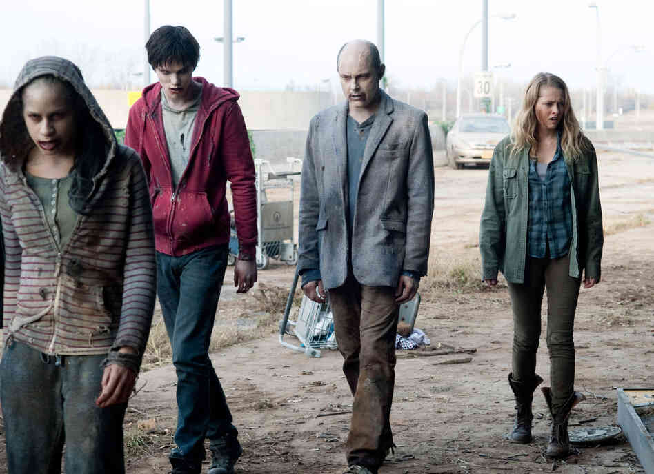 Nicholas Hoult, Rob Corddry and Teresa Palmer lurch through a scene in Levine's zombie romantic comedy.