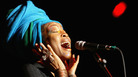 Erykah Badu performs as part of the Sugar Water Festival at the Greek Theatre on Aug. 9, 2005, in Los Angeles, Calif. Erykah Badu performs as part of the Sugar Water Festival at the Greek Theatre on Aug. 9, 2005, in Los Angeles, Calif.