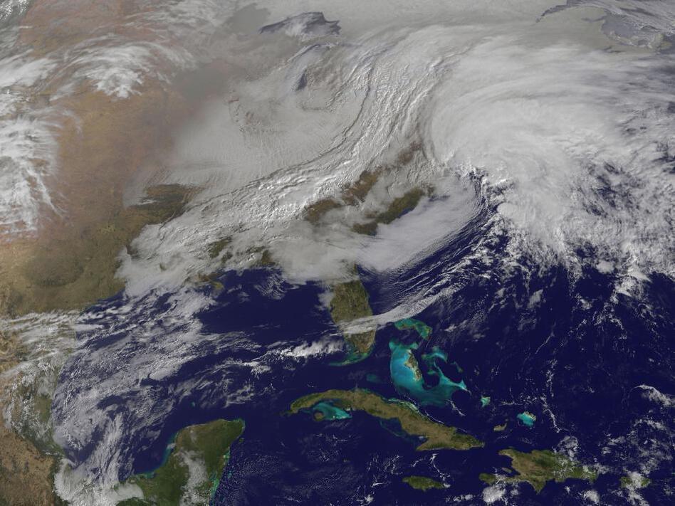 A massive winter storm is coming together as two low pressure systems are merging over the U.S. East Coast. A satellite image from NOAA's GOES-13 satellite on Feb. 8 shows a western frontal system approaching the coastal low pressure area.
