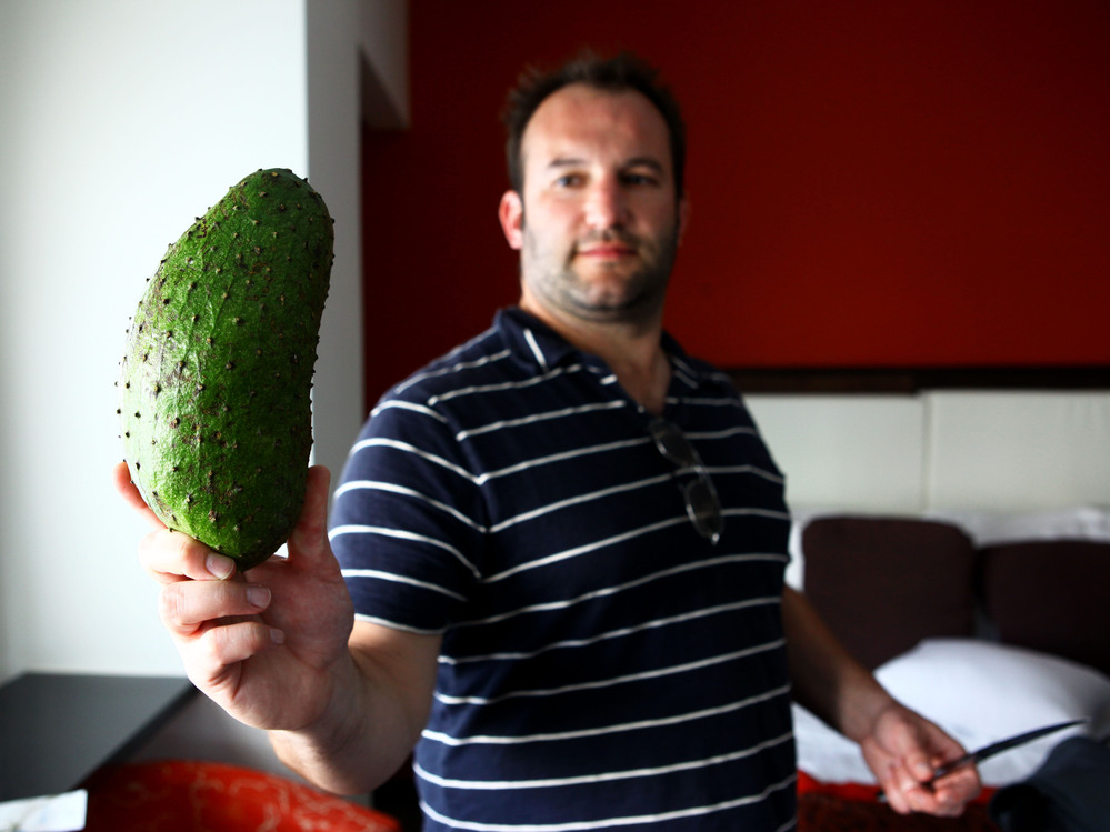 NPR host David Greene shows off a guanabana purchased after a long search for one in Puerto Rico.