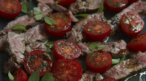 Instead of going to the butcher and asking for a huge hunk of steak cut specially, you can make one supermarket strip steak (it still should be good meat, or don't bother) stretch to feed two of you with no suggestion of scrimping.