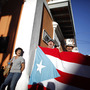 Demonstrators shout against plans to privatize the airport as they carry a Puerto Rican flag near the governor's office in San Juan, Puerto Rico, Wednesday, Feb. 6, 2013. Protesters are demanding the island's largest international airport not be privatized to an investment group. Demonstrators shout against plans to privatize the airport as they carry a Puerto Rican flag near the governor's office in San Juan, Puerto Rico, Wednesday, Feb. 6, 2013. Protesters are demanding the island's largest international airport not be privatized to an investment group.