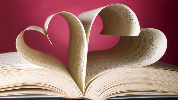 Book with opened pages and shape of heart