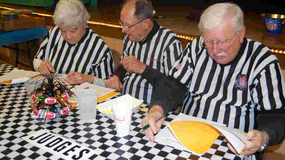Husband-and-wife judges Virginia and Steve Bria (left) alongside Nick Pfister checked answers carefully during each round at last weekend's trivia night at St. Rita Catholic Church in Vinita Park, Mo. Some St. Louis-area trivia fundraisers are massive, while others such as St. Rita's attract a few hundred people. Husband-and-wife judges Virginia and Steve Bria (left) alongside Nick Pfister checked answers carefully during each round at last weekend's trivia night at St. Rita Catholic Church in Vinita Park, Mo. Some St. Louis-area trivia fundraisers are massive, while others such as St. Rita's attract a few hundred people.