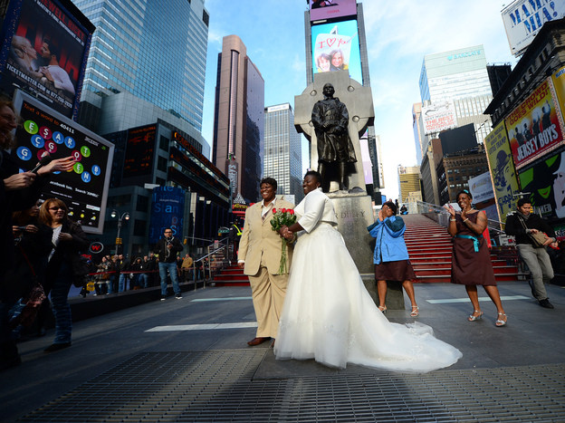 Chris (right) and Renee Wiley pose for a wedding photo on Times Square in New York in December. Same-sex marriage in New York state became legal in July 2011.