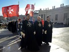Knights of the Order of Malta walk in procession toward St. Peter's Basilica to mark the 900th anniversary of the Order of the Knights of Malta, on Saturday at the Vatican. Knights of the Order of Malta walk in procession toward St. Peter's Basilica to mark the 900th anniversary of the Order of the Knights of Malta, on Saturday at the Vatican.