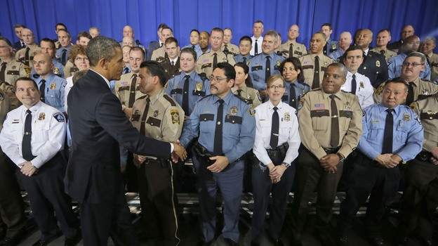 President Obama greets law enforcement officers after speaking on ideas to reduce gun violence at the Minneapolis Police Department Special Operations on Monday.