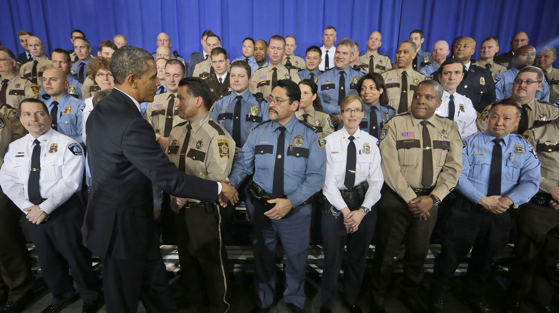 President Obama greets law enforcement officers after speaking on ideas to reduce gun violence at the Minneapolis Police Department Special Operations on Monday.