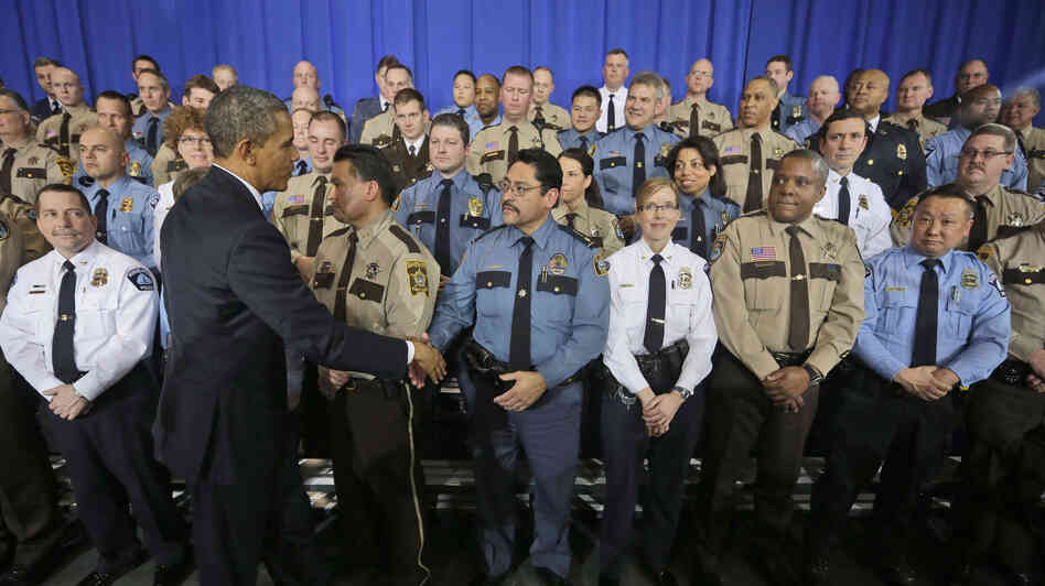 President Obama greets law enforcement officers after speaking on ideas to reduce gun violence at the Minneapolis Police Department Special Operations on Monday.