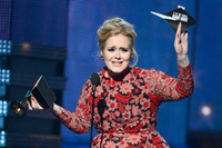 Adele accepts the Grammy for Best Pop Solo Performance for <em>Set Fire to the Rain</em> <em>(Live).</em>