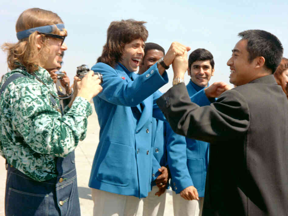 In this photo taken in April 1972 and released by China's Xinhua News Agency, Zhuang Zedong, right, shakes hands with U.S. table tennis player Glenn Cowan during a visit to the U.S. Zhuang, a key figure in 1971's groundbreaking "pingpong diplomacy" between China and the U.S., died in Beijing on Sunday. He was 72.