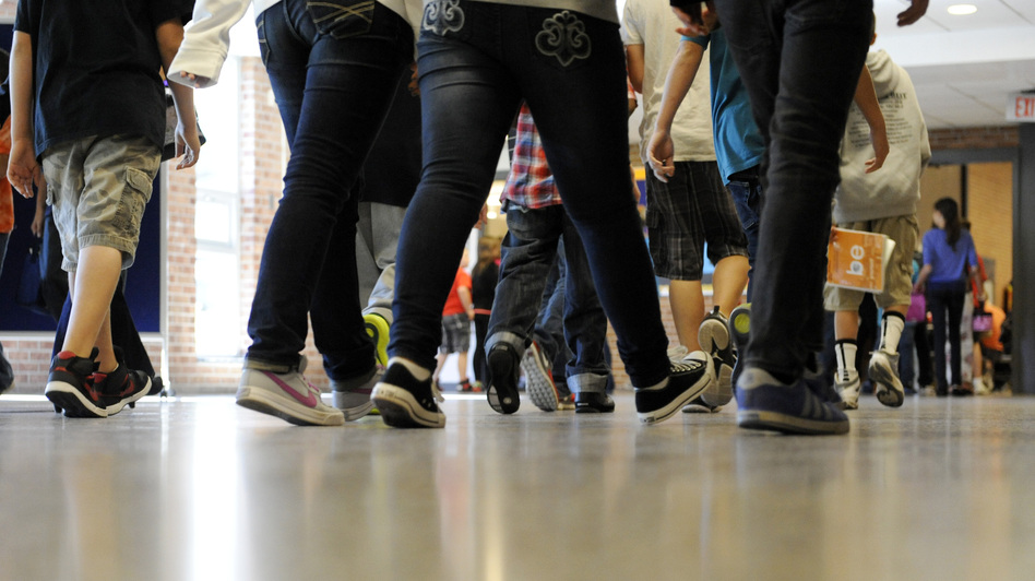 Students walk in the hallway as they enter the lunch line of the cafeteria at Draper Middle School in Rotterdam, N.Y. Five states announced in December that they will add at least 300 hours of learning time to the calendar in some schools starting in 2013.