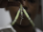 A child prays with his rosary at a Catholic church in Lagos, Nigeria, on Monday. In Africa, where the Catholic Church continues to grow, worshippers and clergy greeted Pope Benedict XVI's announcement that he planned to resign with hopes that the continent would see one of its own rise to lead the faithful. A child prays with his rosary at a Catholic church in Lagos, Nigeria, on Monday. In Africa, where the Catholic Church continues to grow, worshippers and clergy greeted Pope Benedict XVI's announcement that he planned to resign with hopes that the continent would see one of its own rise to lead the faithful.