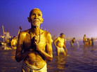 A Hindu devotee prays after a holy dip at the Sangam, the confluence of three holy rivers — the Ganges, the Yamuna and the mythical Saraswati -- during the Kumbh Mela festival in Allahabad, India, on Sunday. A Hindu devotee prays after a holy dip at the Sangam, the confluence of three holy rivers — the Ganges, the Yamuna and the mythical Saraswati -- during the Kumbh Mela festival in Allahabad, India, on Sunday.