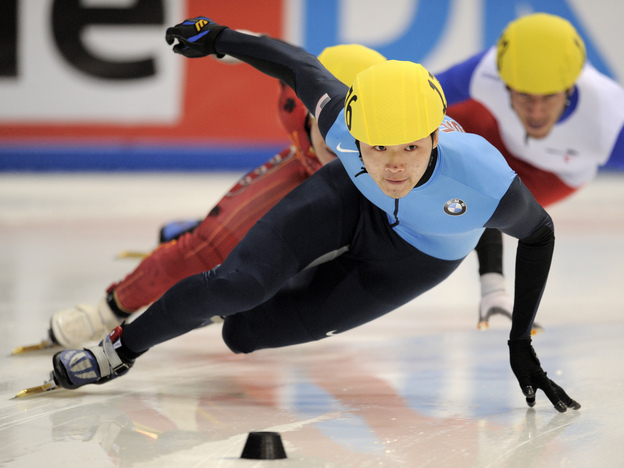 Simon Cho competes in the men's 500-meter finals at the 2011 ISU World Cup short track speedskating final in Dresden, Germany. He won the event.