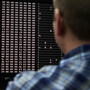 An analyst looks at code in the malware lab of a cybersecurity defense lab at the Idaho National Laboratory in Idaho Falls, Idaho, Sept. 29, 2011.