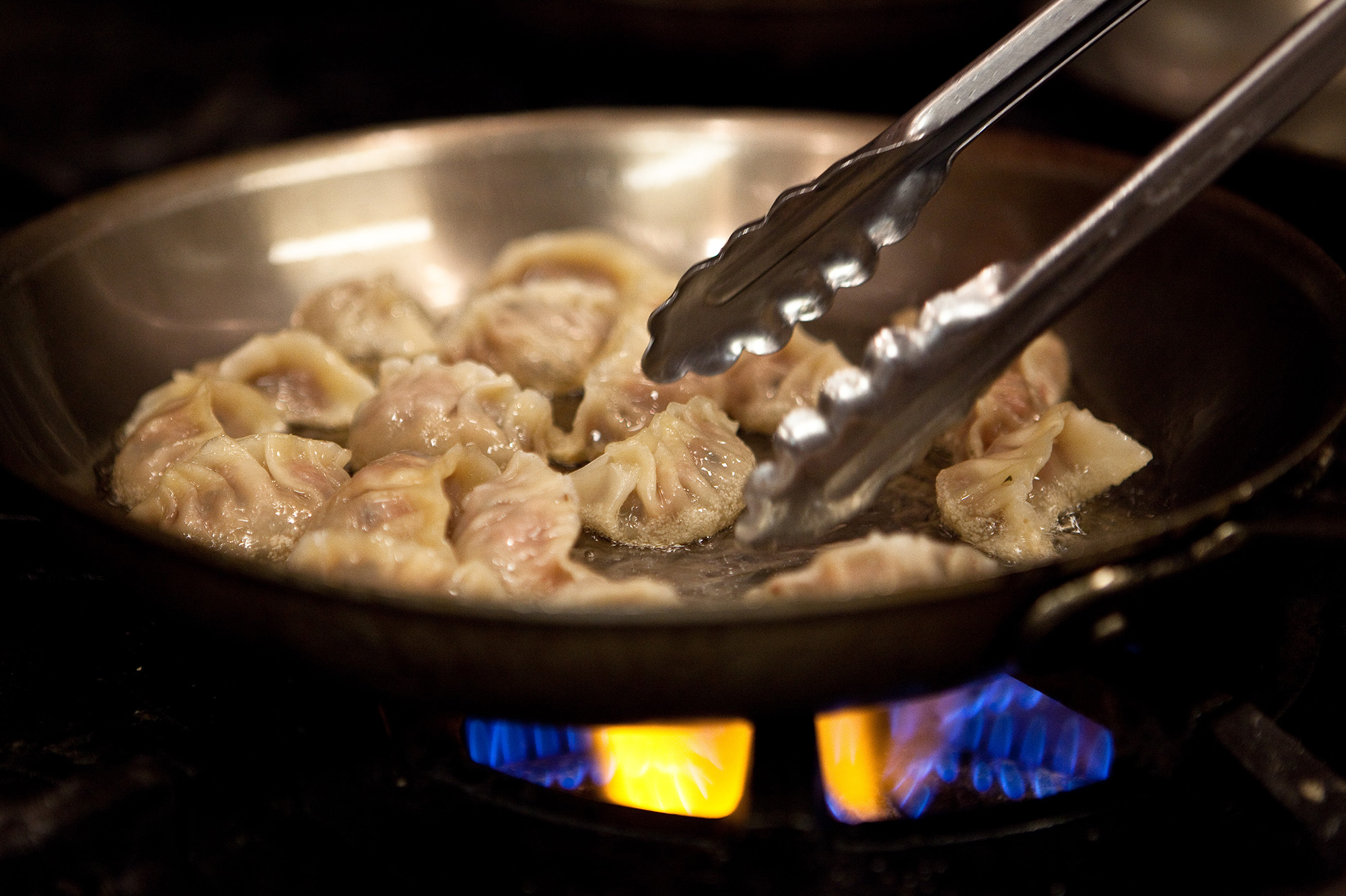 Crinkled on one side, flat on the other, the dumplings are boiled for about five minutes until they float, then transferred, flat side down, into a pan of sizzling hot peanut oil. Only one side of the dumpling is fried, and briefly! They may be called potstickers, but that's the last thing you actually want them to do in your pan. Crinkled on one side, flat on the other, the dumplings are boiled for about five minutes until they float, then transferred, flat side down, into a pan of sizzling hot peanut oil. Only one side of the dumpling is fried, and briefly! They may be called potstickers, but that's the last thing you actually want them to do in your pan.