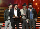 Mumford & Sons (from left: Ben Lovett, Marcus Mumford, Ted Dwane and Winston Marshall) accept the award for album of the year at the Grammy Awards on Sunday night. Mumford & Sons (from left: Ben Lovett, Marcus Mumford, Ted Dwane and Winston Marshall) accept the award for album of the year at the Grammy Awards on Sunday night.