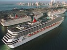In a photo from 1999, the Carnival Cruise line Carnival Triumph, foreground, arrives in Miami. Measuring 893 feet in length, the ship has been adrift in the Gulf of Mexico for more than 24 hours, after a fire hit its engines. In a photo from 1999, the Carnival Cruise line Carnival Triumph, foreground, arrives in Miami. Measuring 893 feet in length, the ship has been adrift in the Gulf of Mexico for more than 24 hours, after a fire hit its engines.