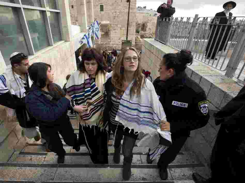 Rabbi Susan Silverman (center, left), the sister of American comedian Sarah Silverman, along with her teenage daughter Hallel Abramowitz (center, right), are arrested by Israeli police as they leave the Western Wall in Jerusalem, on Monday. Rabbi Susan Silverman (center, left), the sister of American comedian Sarah Silverman, along with her teenage daughter Hallel Abramowitz (center, right), are arrested by Israeli police as they leave the Western Wall in Jerusalem, on Monday.