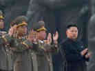 North Korean leader Kim Jong Un (right) claps during a ceremony unveiling statues honoring his grandfather and father, Kim Il Sung and Kim Jong Il, respectively, in Pyongyang last April. North Korean leader Kim Jong Un (right) claps during a ceremony unveiling statues honoring his grandfather and father, Kim Il Sung and Kim Jong Il, respectively, in Pyongyang last April.