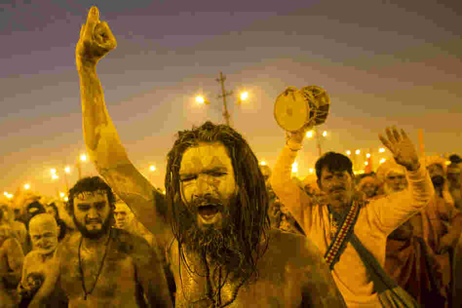 Naga sadhus, naked holy men, walk in procession after bathing on the auspicious day of Mauni Amavasya on Sunday.