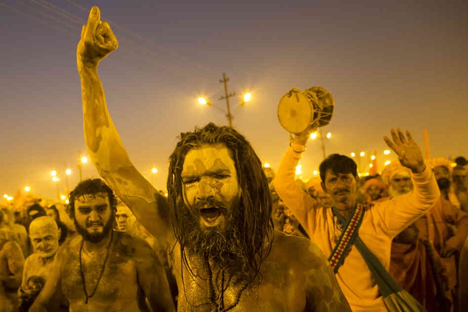 Naga sadhus, naked holy men, walk in procession after bathing on the auspicious day of Mauni Amavasya on Sunday.
