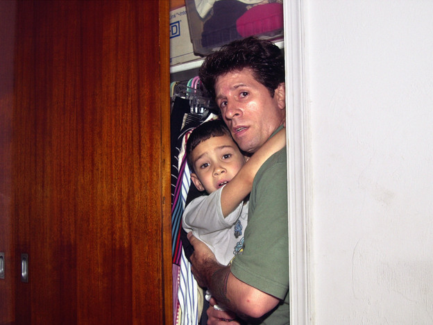 Fisherman Donato Dalrymple holds 6-year-old Elian Gonzalez inside a bedroom closet moments before federal agents entered the bedroom on April 22, 2000, and seized the boy to reunite him with his father in Washington.