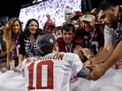 Katherine Webb (left), the girlfriend of Alabama quarterback A.J. McCarron, and McCarron's mother, Dee Dee Bonner (second from left), watch McCarron celebrate after the BCS National Championship college football game on Jan. 7. Webb was caught on camera and announcer Brent Musburger enthusiastically remarked that quarterbacks "get all the good-looking women." ESPN later apologized. Katherine Webb (left), the girlfriend of Alabama quarterback A.J. McCarron, and McCarron's mother, Dee Dee Bonner (second from left), watch McCarron celebrate after the BCS National Championship college football game on Jan. 7. Webb was caught on camera and announcer Brent Musburger enthusiastically remarked that quarterbacks "get all the good-looking women." ESPN later apologized.