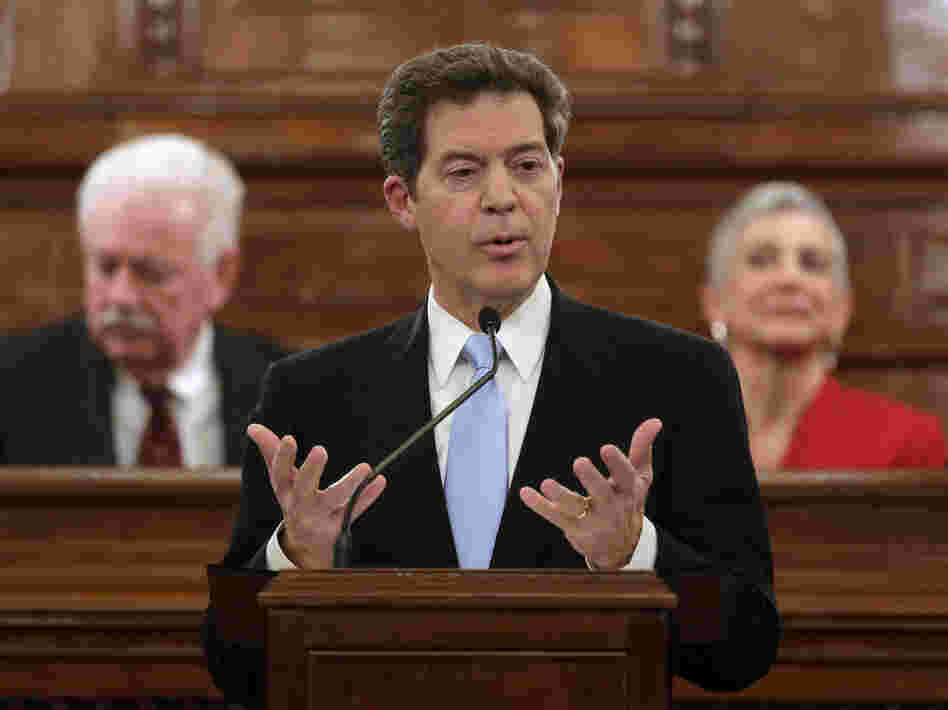 Kansas Gov. Sam Brownback, shown delivering the State of the State address last month, is pushing to get rid of the state's income tax, which has some Republicans concerned.