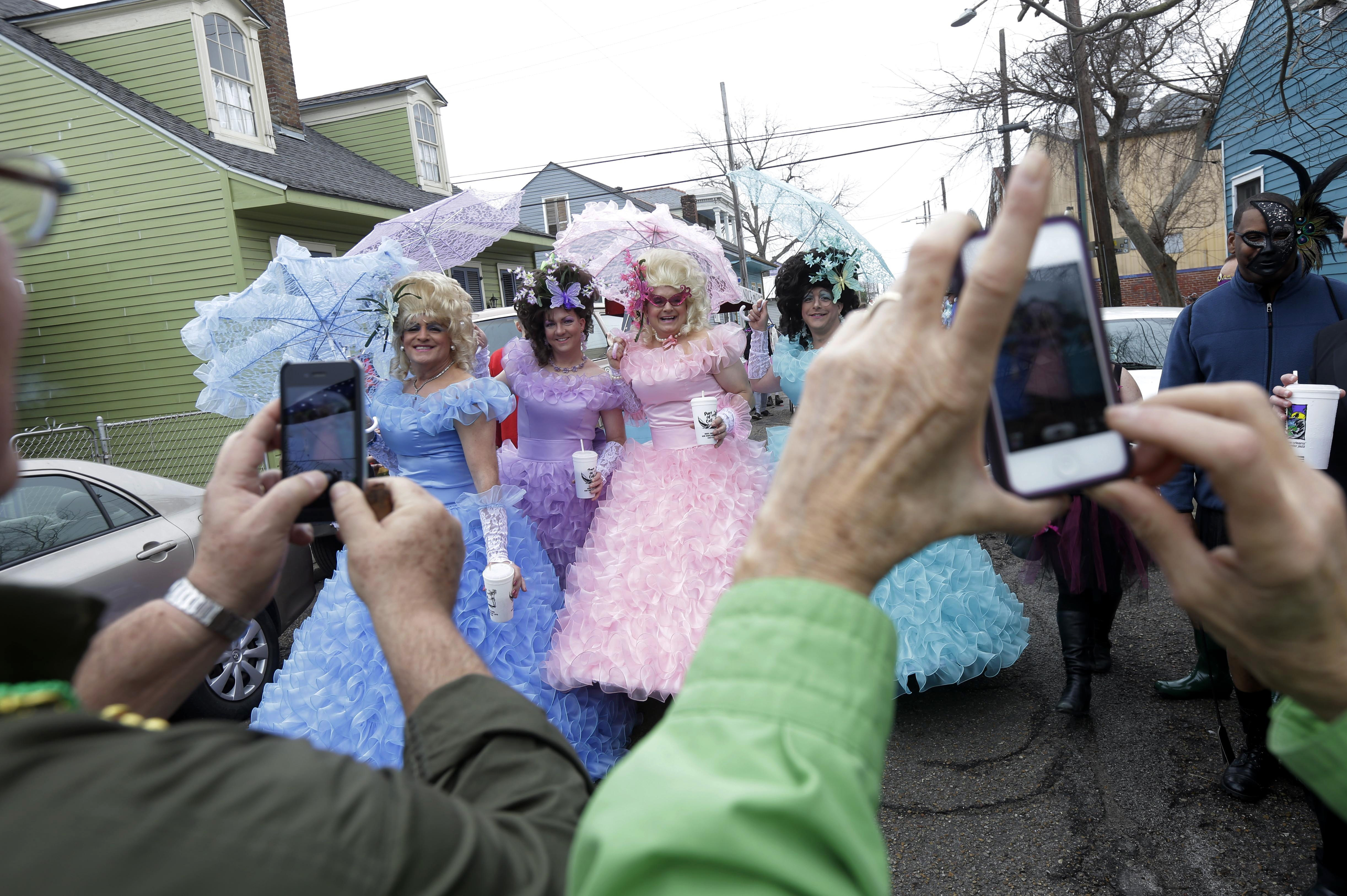 Tuesday: Revelers gather before the start of the Society of Saint Anne parade.