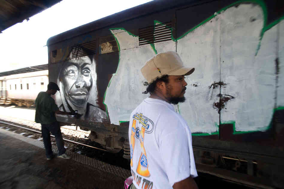 27-year-old Uhuru B has been a graffiti artist for 12 years. "What we're doing here now is part of a civic education, and also a way to advertise peace," he says.