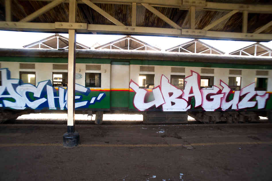 "Tuwache Ubaguzi" is part of a longer phrase written across the 10-car train, quoting the first line of a poem composed by a 13-year-old girl from Kibera. The full text translates to "Down with tribalism, down with discrimination, let's live in peace."