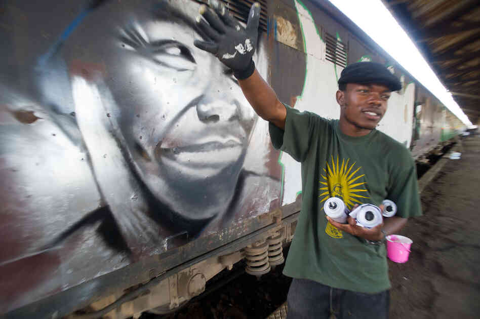 Kenyan graffiti artists received permission from the Rift Valley Railway to spray-paint a 10-car commuter train with messages of peace. Here, true to his name, Swift9 finishes his piece before anyone else: a portrait of Nobel Peace Prize winner Wangari Maathai.