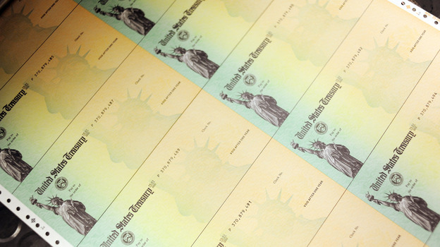 U.S. Treasury checks are run through a printer.