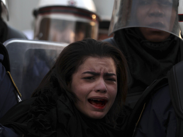 Riot police arrest an anti-government protester during a pro-democracy protest in the Bahraini capital, Manama, on Jan. 18.