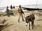 Soldiers secure the port in Gao, Mali on Tuesday, Feb. 12, 2013. Soldiers secure the port in Gao, Mali on Tuesday, Feb. 12, 2013.