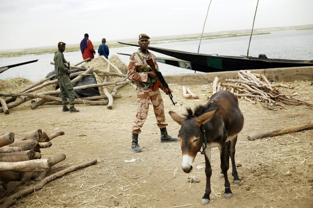 Soldiers secure the port in Gao, Mali on Tuesday, Feb. 12, 2013.