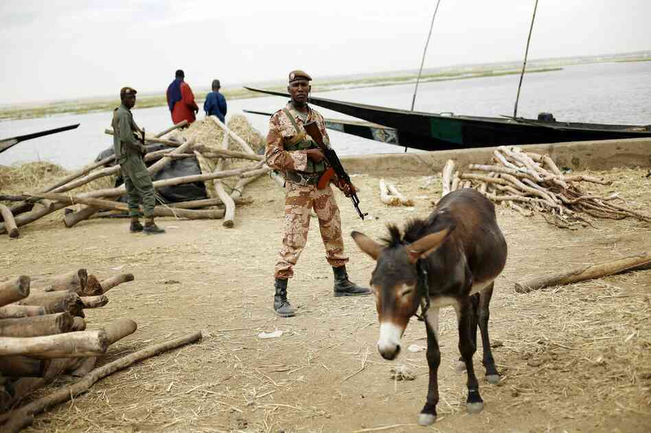 Soldiers secure the port in Gao, Mali on Tuesday, Feb. 12, 2013.