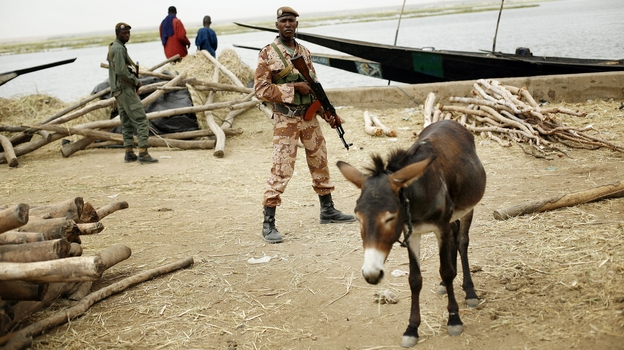 Soldiers secure the port in Gao, Mali on Tuesday, Feb. 12, 2013. (AP)