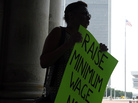 Wendy Brown of Schenectady, N.Y., holds a sign before an Occupy Albany rally pushing for a raise in New York's minimum wage on May 29, 2012. Wendy Brown of Schenectady, N.Y., holds a sign before an Occupy Albany rally pushing for a raise in New York's minimum wage on May 29, 2012.