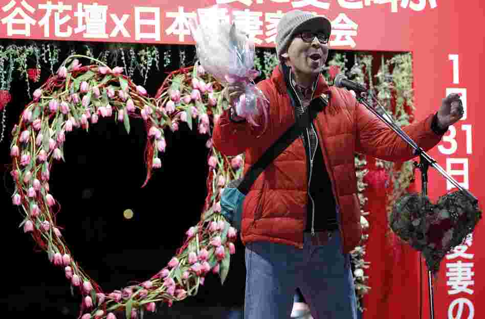 A man shouts his love at an event in Tokyo on Jan. 29. The event comes two days ahead of Beloved Wives Day, a day on which husbands publicly scream their love for their wives before a crowd of onlookers. Husbands are also urged to head home early to express gratitude to their wives.