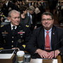 Joint Chiefs of Staff Chairman Martin Dempsey (from left), Deputy Secretary of Defense Ashton Carter and Undersecretary of Defense and Comptroller Robert Hale wait for a hearing of the Senate Armed Services Committee on Tuesday. Military leaders are warning Congress about the effects of the sequester.