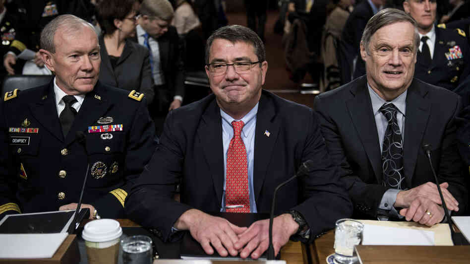 Joint Chiefs of Staff Chairman Martin Dempsey (from left), Deputy Secretary of Defense Ashton Carter and Undersecretary of Defense and Comptroller Robert Hale wait for a hearing of the Senate Armed Services Committee on Tuesday. Military leaders are warning Congress about the effects of the sequester.