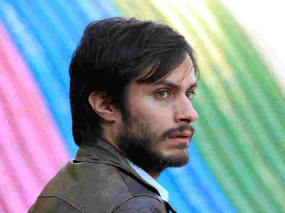 The bright colors and throwback feel of the Chilean drama No mask the very real political consequences of the 1988 plebiscite it depicts. (Pictured: Gael Garcia Bernal as Rene Saavedra)
