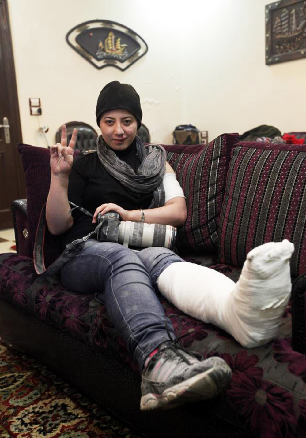 Kelze recently suffered a broken ankle when a wall collapsed on her during a firefight. She is recovering in Turkey, but plans to return to the front lines after she heals.